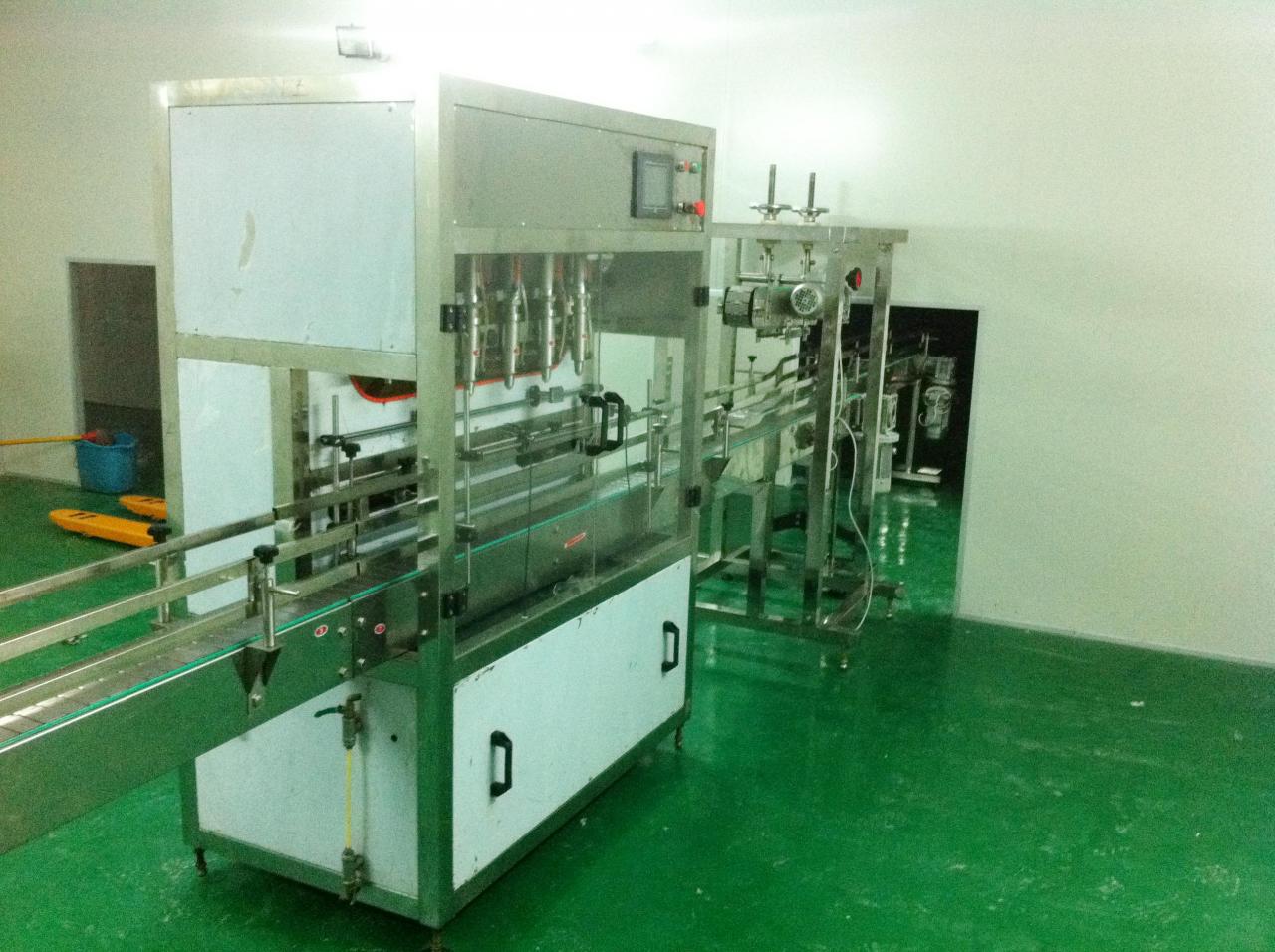 Linear filling machine with 4 filling heads Шугаман дүүргэгч машин.jpg