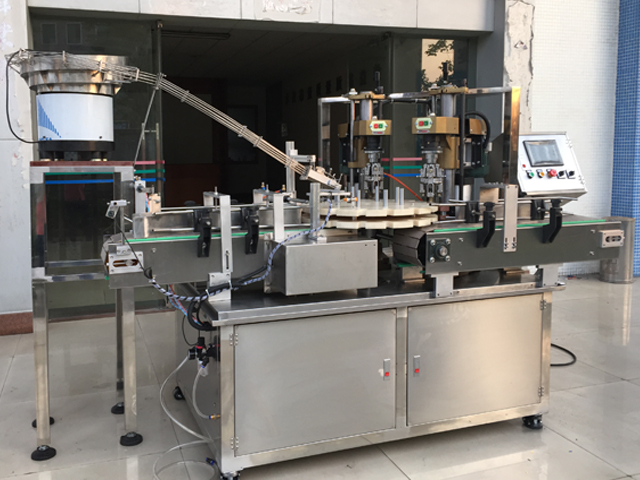 capping machine with 2 capping heads шураг таглах тоног төхөөрөмж хагас автомат.jpg