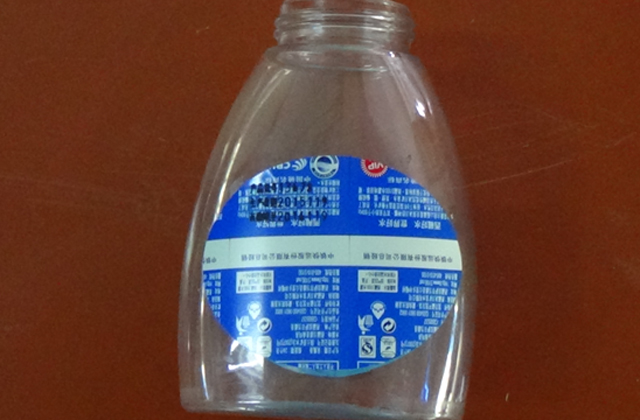 Хавтгай лонхны дээжийн өнхрөх шошго машин.jpg